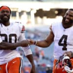 Jadeveon Clowney #90 and Anthony Walker #4 of the Cleveland Browns celebrate after defeating the Cincinnati Bengals 41-16 at Paul Brown Stadium on November 07, 2021 in Cincinnati, Ohio.