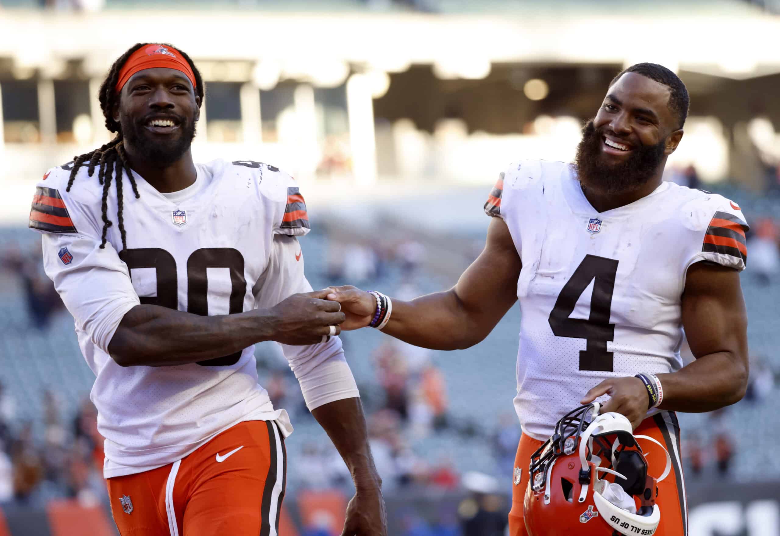 Jadeveon Clowney #90 and Anthony Walker #4 of the Cleveland Browns celebrate after defeating the Cincinnati Bengals 41-16 at Paul Brown Stadium on November 07, 2021 in Cincinnati, Ohio. 