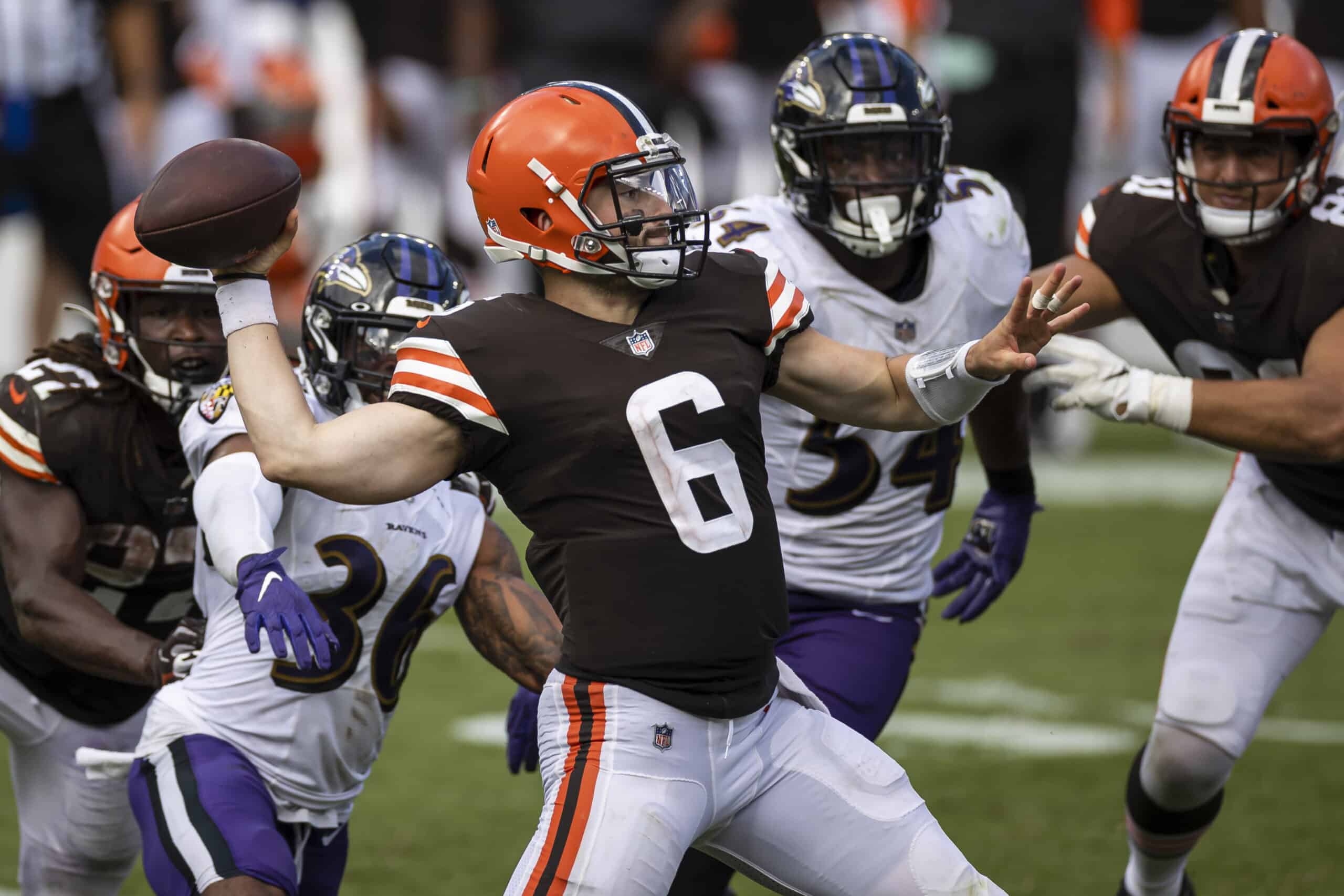 Baker Mayfield #6 of the Cleveland Browns attempts a pass as Chuck Clark #36 of the Baltimore Ravens applies pressure during the second half at M&T Bank Stadium on September 13, 2020 in Baltimore, Maryland. 