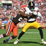 Greg Newsome II #20 of the Cleveland Browns tackles Diontae Johnson #18 of the Pittsburgh Steelers during the second half at FirstEnergy Stadium on October 31, 2021 in Cleveland, Ohio.