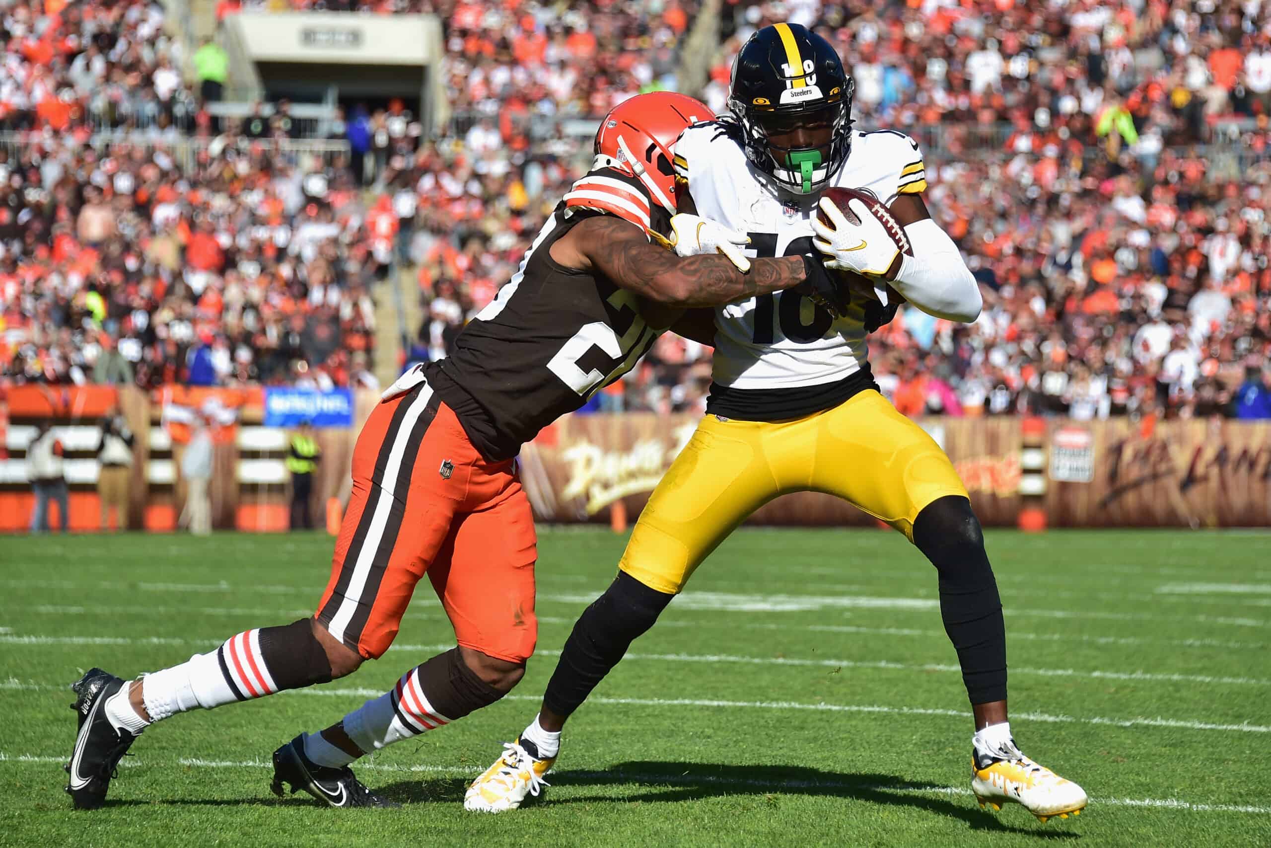 Greg Newsome II #20 of the Cleveland Browns tackles Diontae Johnson #18 of the Pittsburgh Steelers during the second half at FirstEnergy Stadium on October 31, 2021 in Cleveland, Ohio.