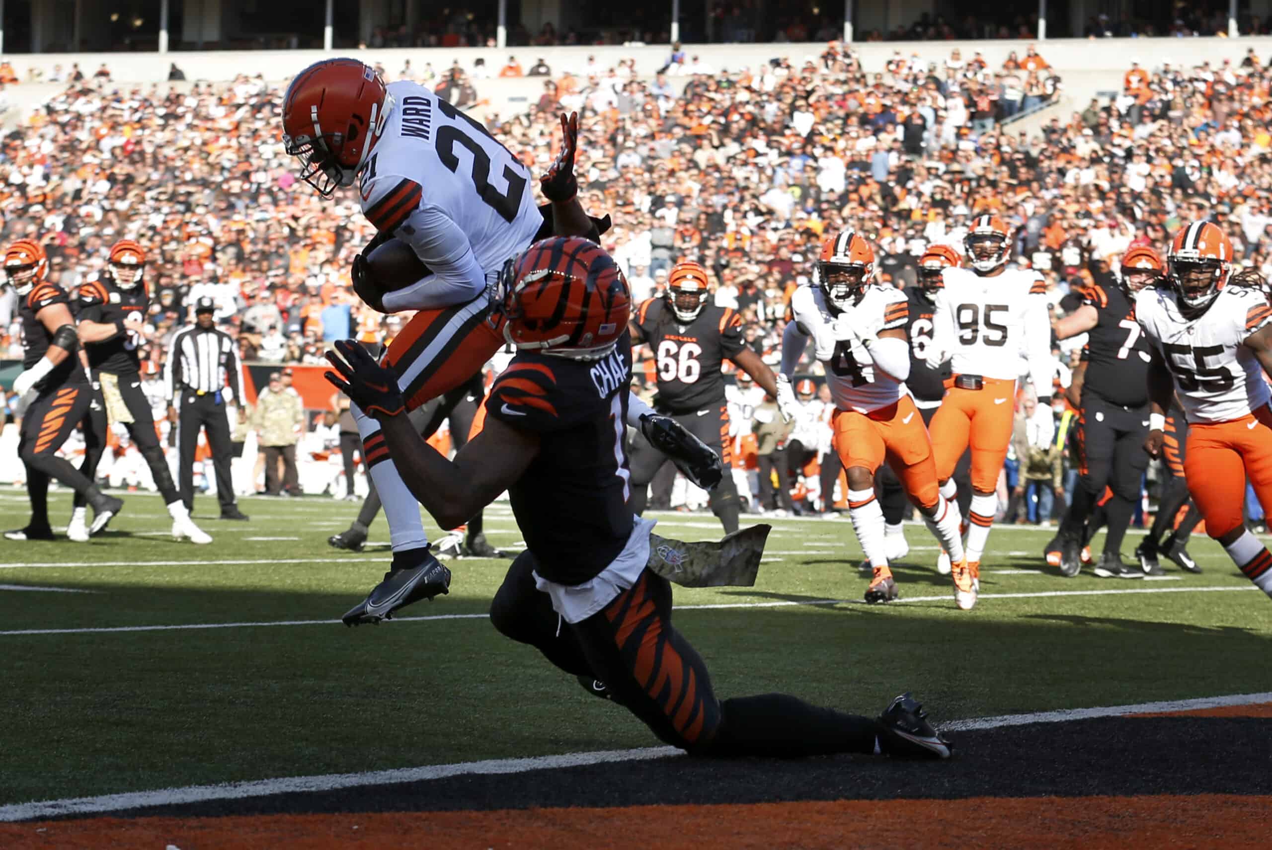 Denzel Ward #21 of the Cleveland Browns intercepts the ball thrown by Joe Burrow #9 of the Cincinnati Bengals and returns it for a touchdown during the first quarter at Paul Brown Stadium on November 07, 2021 in Cincinnati, Ohio. 