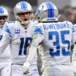 Godwin Igwebuike #35 of the Detroit Lions celebrates his rushing touchdown with Jared Goff #16 in the third quarter against the Pittsburgh Steelers at Heinz Field on November 14, 2021 in Pittsburgh, Pennsylvania.
