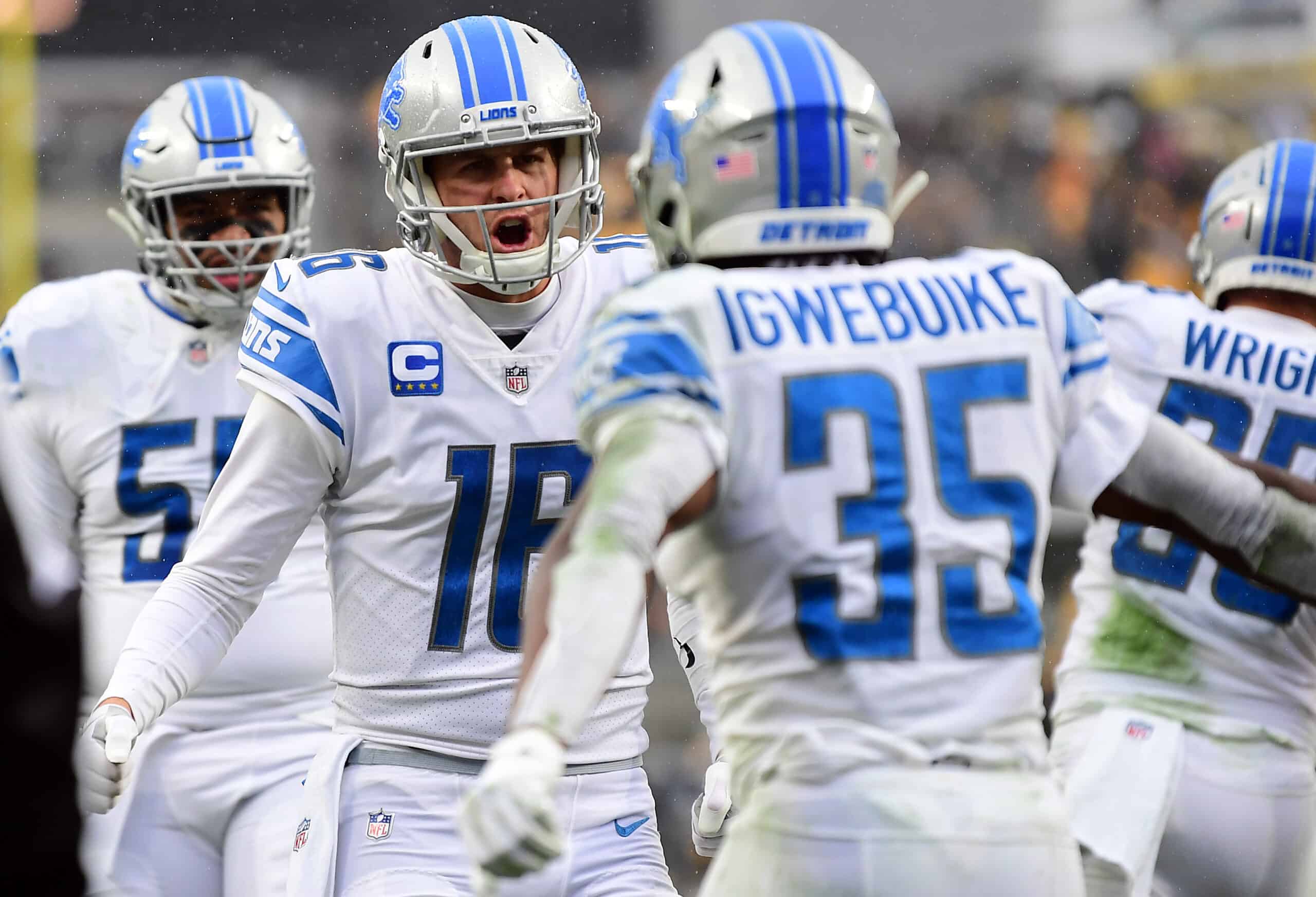 Godwin Igwebuike #35 of the Detroit Lions celebrates his rushing touchdown with Jared Goff #16 in the third quarter against the Pittsburgh Steelers at Heinz Field on November 14, 2021 in Pittsburgh, Pennsylvania.