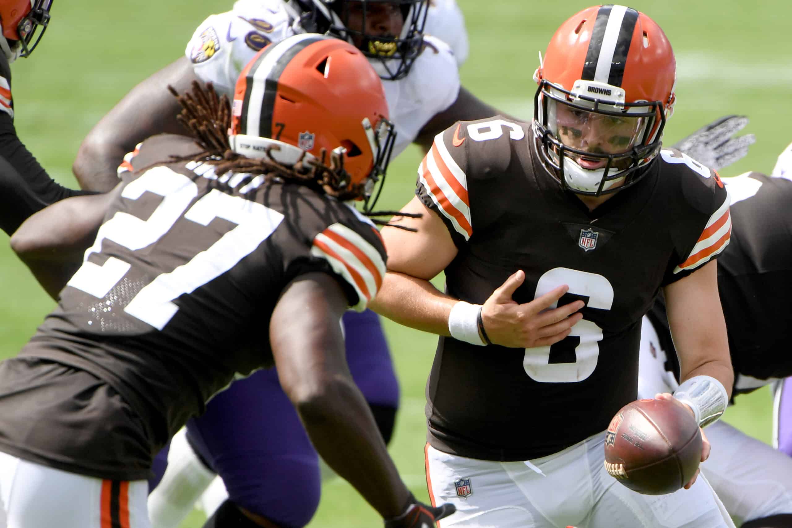 Baker Mayfield #6 hands the ball off to Kareem Hunt #27 of the Cleveland Browns during the first half against the Baltimore Ravens at M&T Bank Stadium on September 13, 2020 in Baltimore, Maryland.