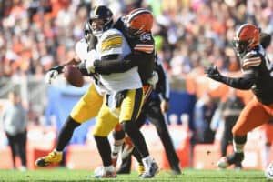 Myles Garrett #95 of the Cleveland Browns sacks Ben Roethlisberger #7 of the Pittsburgh Steelers during the first half at FirstEnergy Stadium on October 31, 2021 in Cleveland, Ohio.