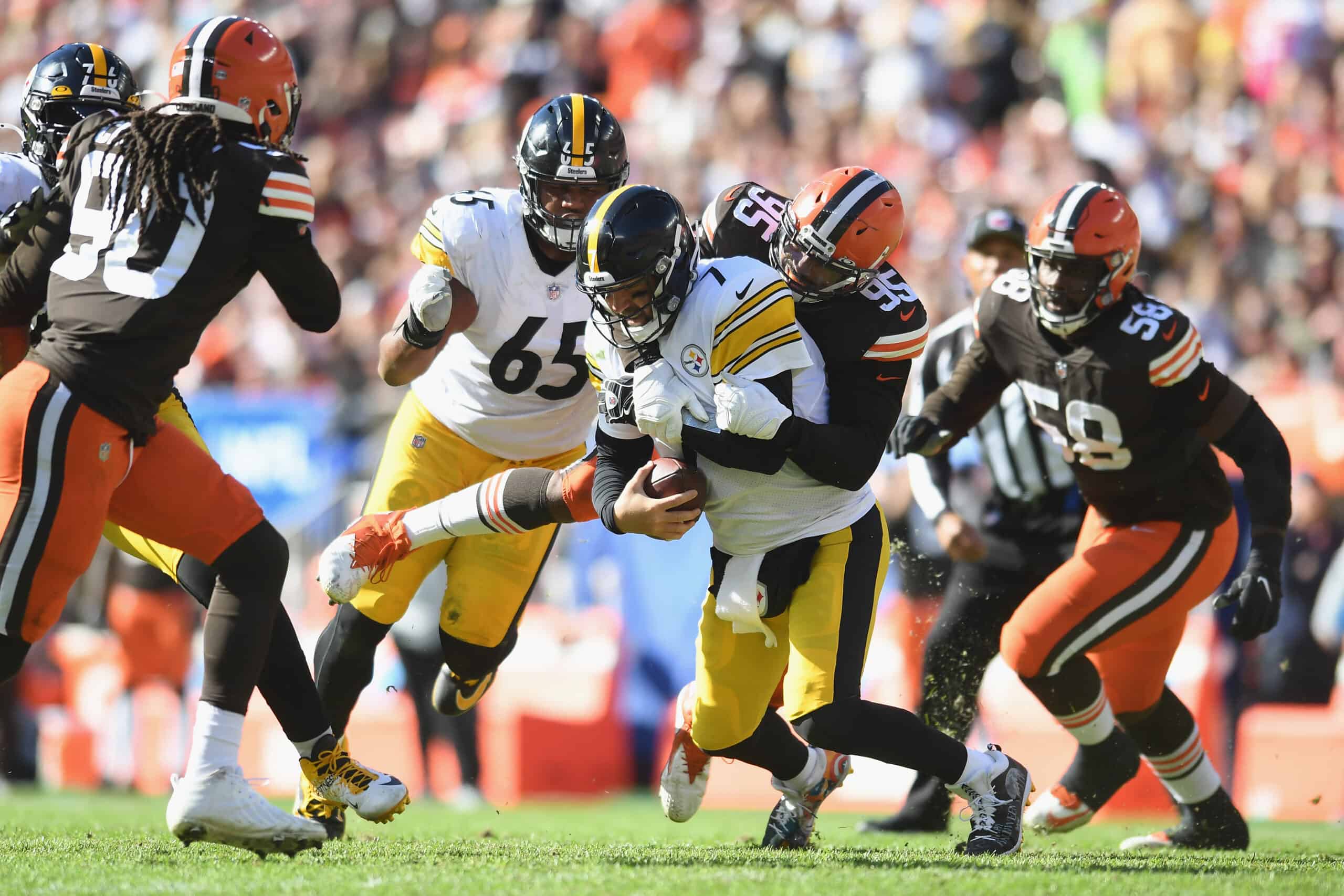 Myles Garrett #95 of the Cleveland Browns sacks Ben Roethlisberger #7 of the Pittsburgh Steelers in the first half of their game at FirstEnergy Stadium on October 31, 2021 in Cleveland, Ohio.