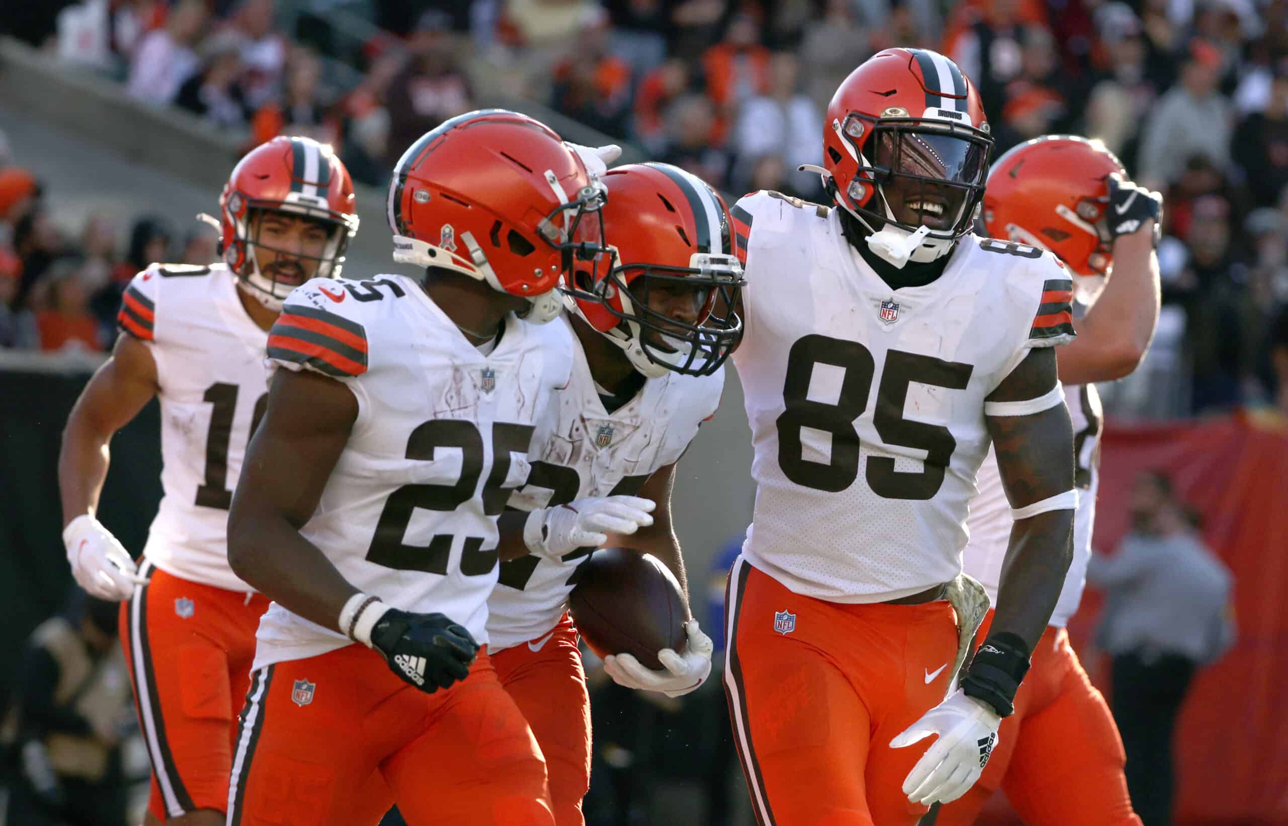 Nick Chubb #24 of the Cleveland Browns celebrates his touchdown run with Demetric Felton #25 and David Njoku #85 during the third quarter against the Cincinnati Bengals at Paul Brown Stadium on November 07, 2021 in Cincinnati, Ohio.