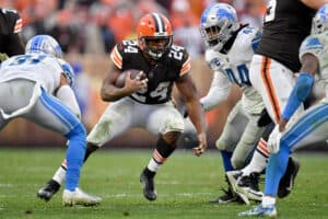 Nick Chubb #24 of the Cleveland Browns runs with the ball against the Detroit Lions in the second half at FirstEnergy Stadium on November 21, 2021 in Cleveland, Ohio.