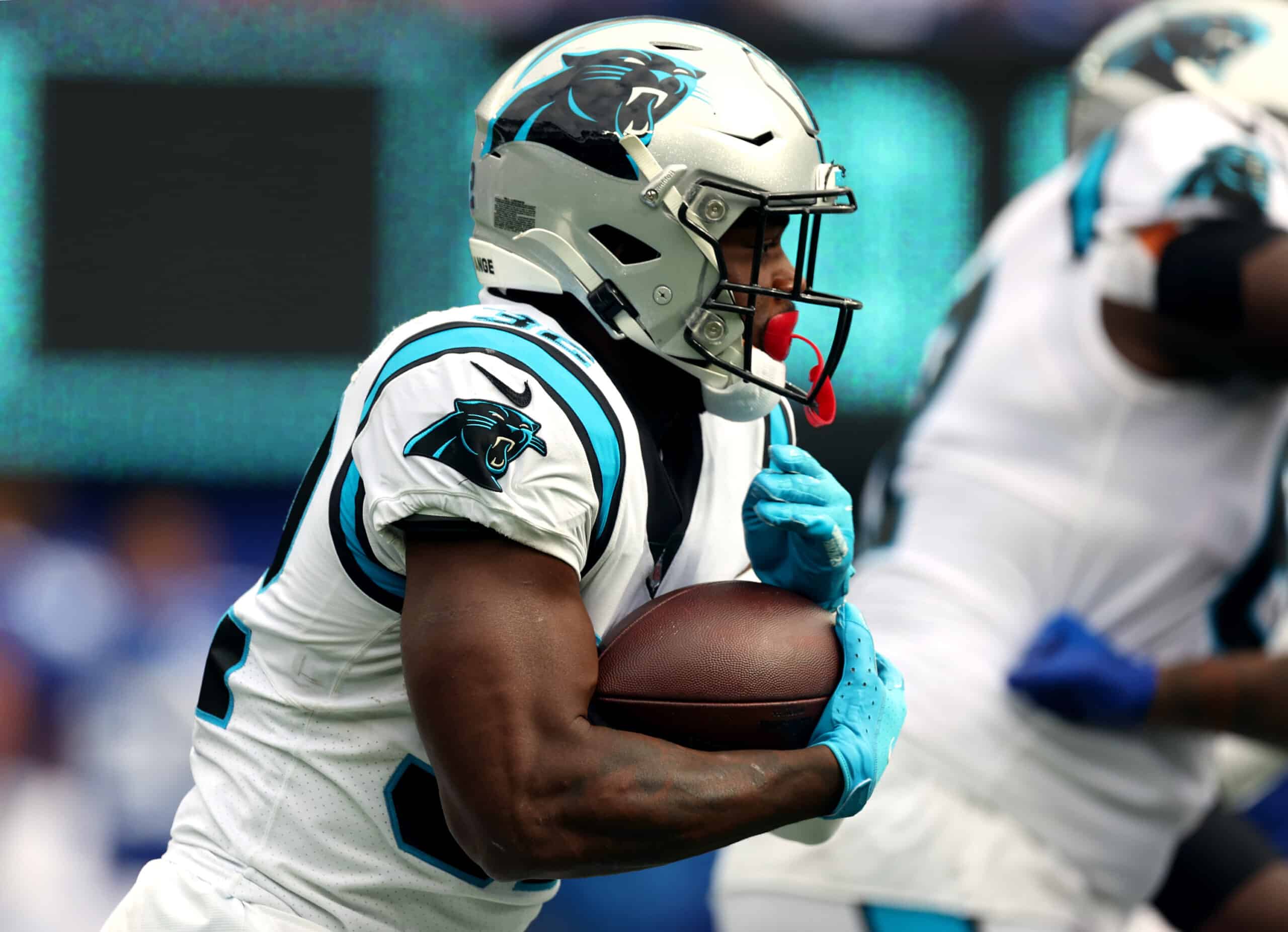 Royce Freeman #32 of the Carolina Panthers runs with the ball during the first half in the game against the New York Giants at MetLife Stadium on October 24, 2021 in East Rutherford, New Jersey. 