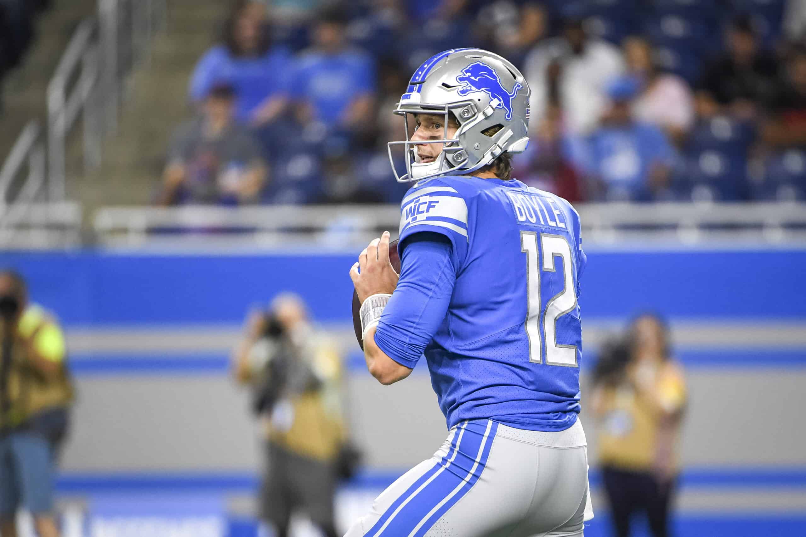 Tim Boyle #12 of the Detroit Lions scans the field against the Buffalo Bills during the third quarter of a preseason game at Ford Field on August 13, 2021 in Detroit, Michigan.