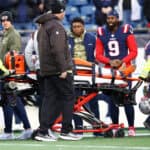 Troy Hill #23 of the Cleveland Browns is carted off the field during the second half against the New England Patriots at Gillette Stadium on November 14, 2021 in Foxborough, Massachusetts.