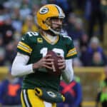 Aaron Rodgers #12 of the Green Bay Packers throws a pass during a game against the Los Angeles Rams at Lambeau Field on November 28, 2021 in Green Bay, Wisconsin. The Packers defeated the Rams 36-28.