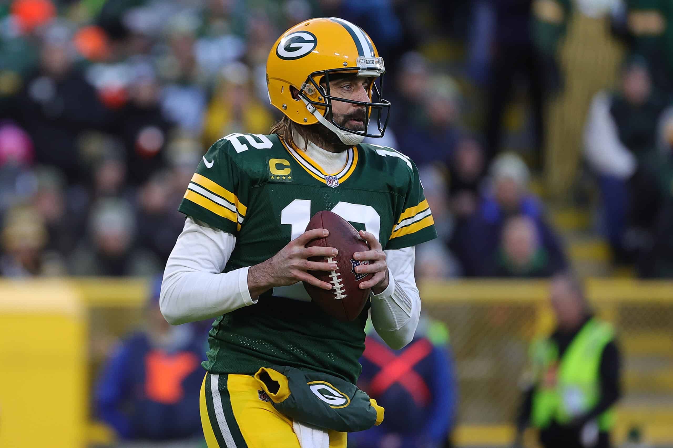 Aaron Rodgers #12 of the Green Bay Packers throws a pass during a game against the Los Angeles Rams at Lambeau Field on November 28, 2021 in Green Bay, Wisconsin. The Packers defeated the Rams 36-28.