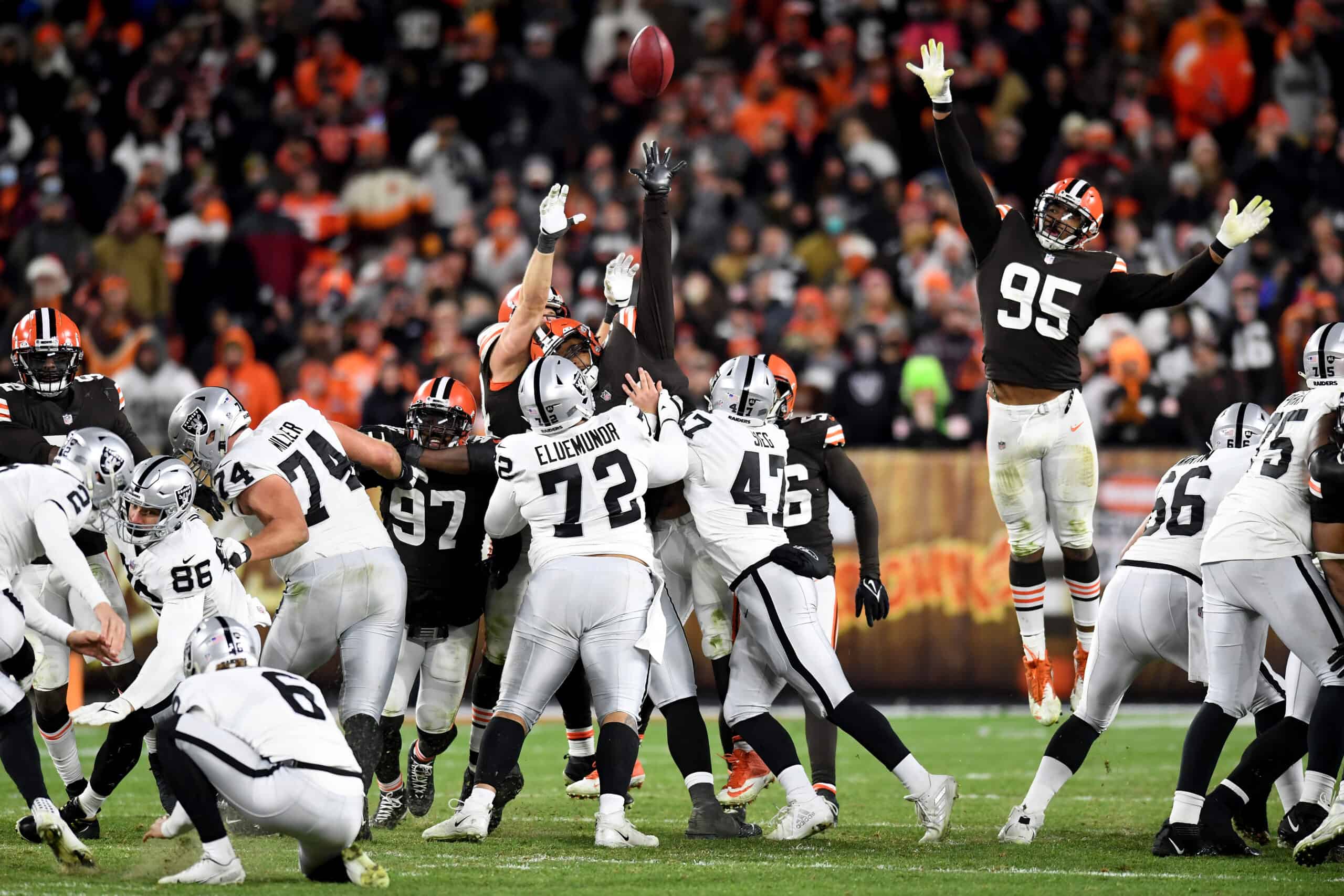 The Cleveland Browns attempt to defend as a field goal is kicked in the fourth quarter of the game against the Las Vegas Raiders at FirstEnergy Stadium on December 20, 2021 in Cleveland, Ohio.