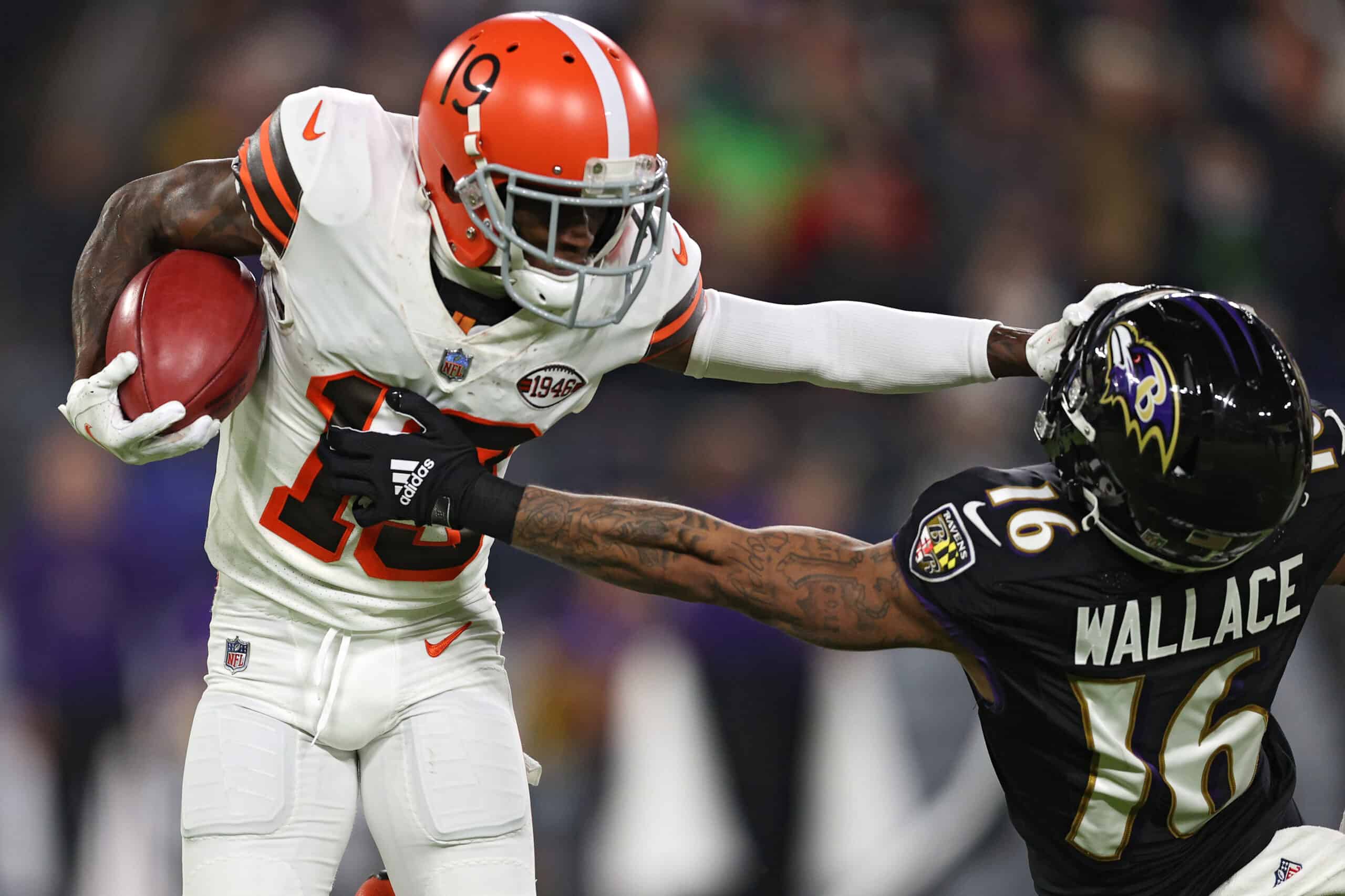 JoJo Natson #19 of the Cleveland Browns stiff arms Tylan Wallace #16 of the Baltimore Ravens during the first half at M&T Bank Stadium on November 28, 2021 in Baltimore, Maryland. 