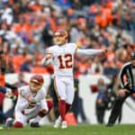 Washington Football Team kicker Chris Blewitt (12) kicks a field goal during a game between the Denver Broncos and the Washington Football Team at Empower Field at Mile High on October 31, 2021 in Denver, Colorado.