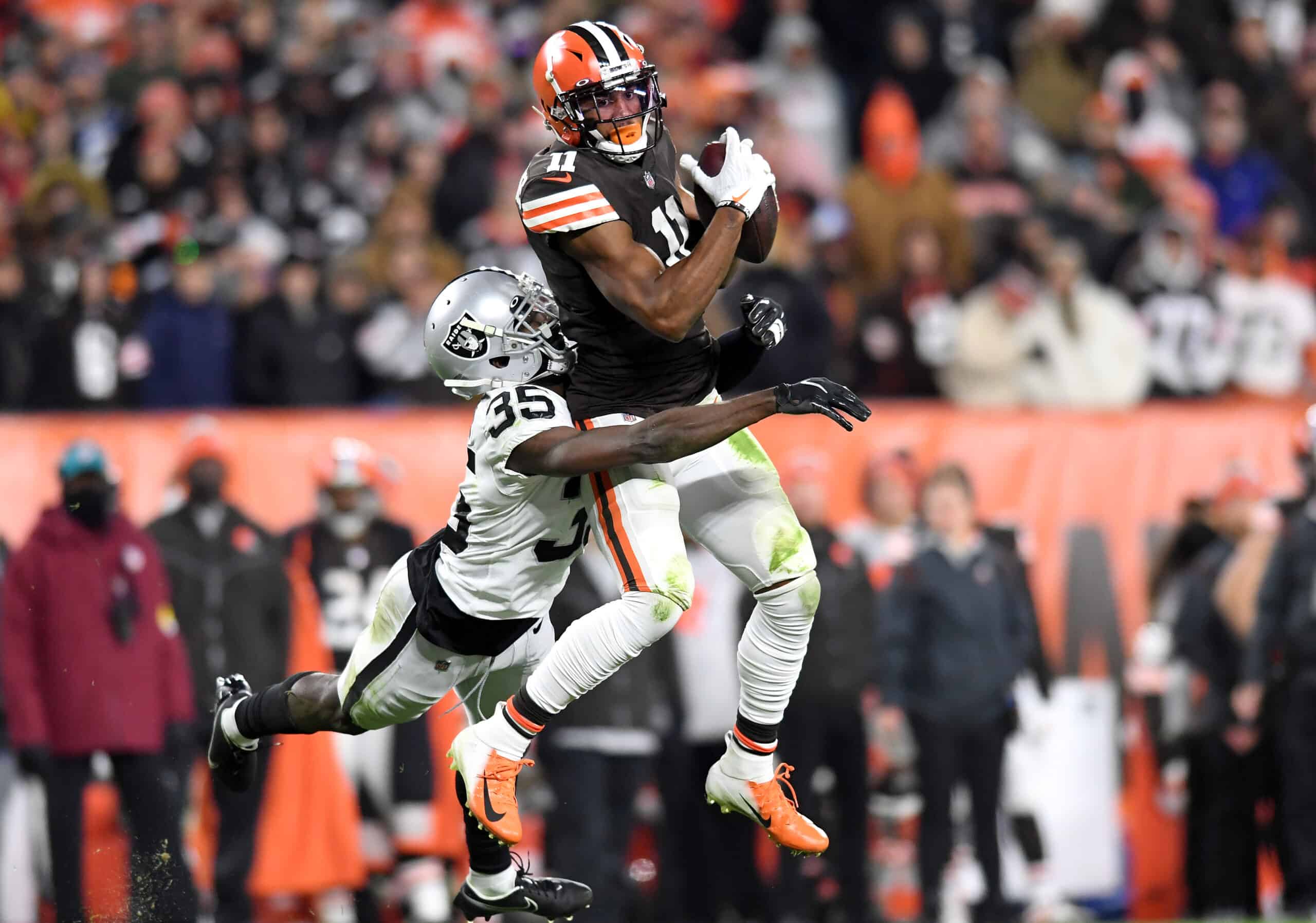 Donovan Peoples-Jones #11 of the Cleveland Browns catches the ball against Brandon Facyson #35 of the Las Vegas Raiders in the second half at FirstEnergy Stadium on December 20, 2021 in Cleveland, Ohio.