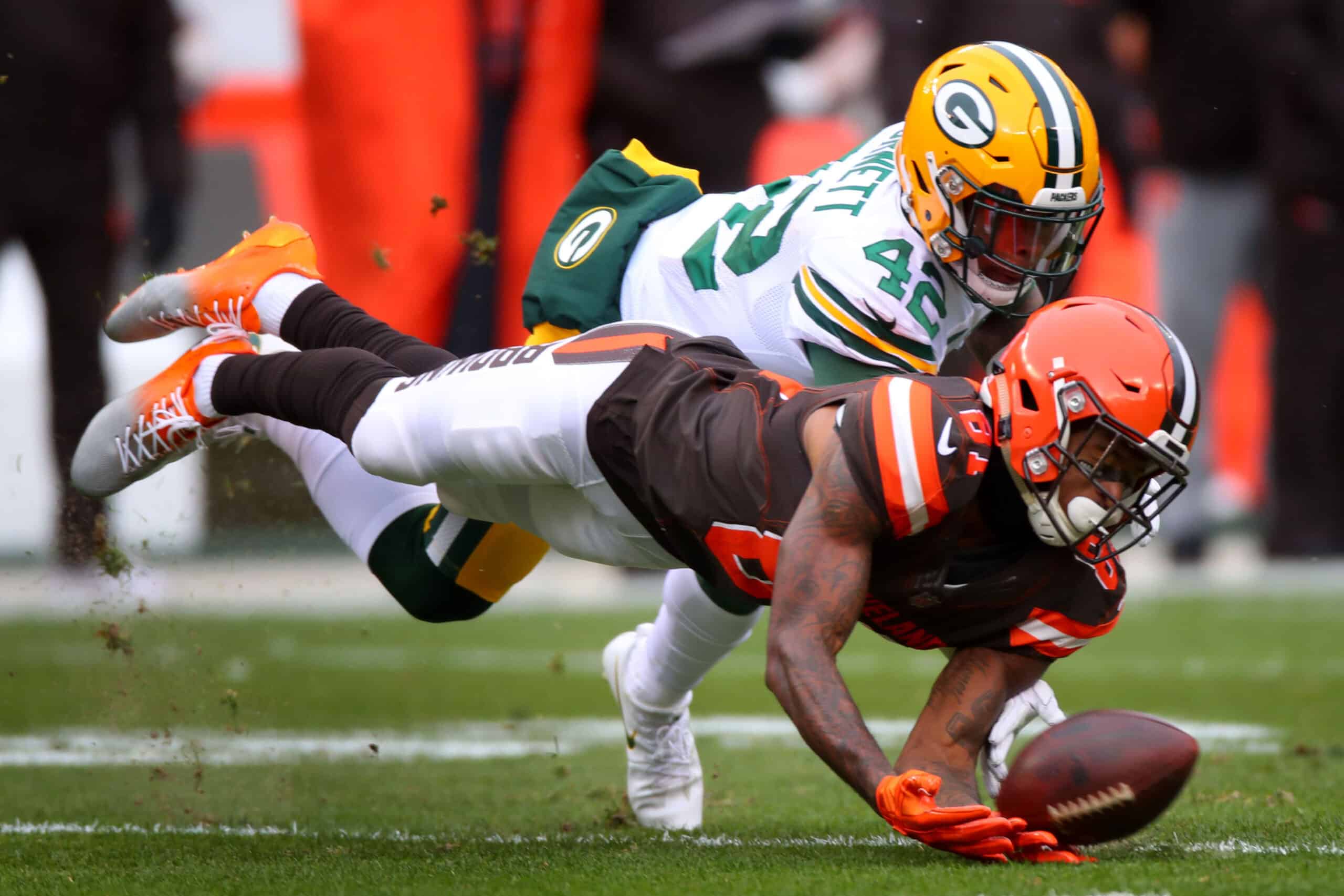 Rashard Higgins #81 of the Cleveland Browns dives to catch the ball defended by Morgan Burnett #42 of the Green Bay Packers in the second quarter at FirstEnergy Stadium on December 10, 2017 in Cleveland, Ohio. 