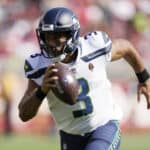 Russell Wilson #3 of the Seattle Seahawks runs for a touchdown during the third quarter against the San Francisco 49ers at Levi's Stadium on October 03, 2021 in Santa Clara, California.