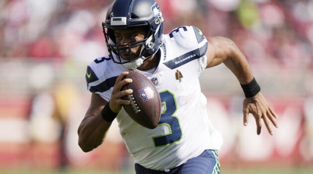 Russell Wilson #3 of the Seattle Seahawks runs for a touchdown during the third quarter against the San Francisco 49ers at Levi's Stadium on October 03, 2021 in Santa Clara, California.