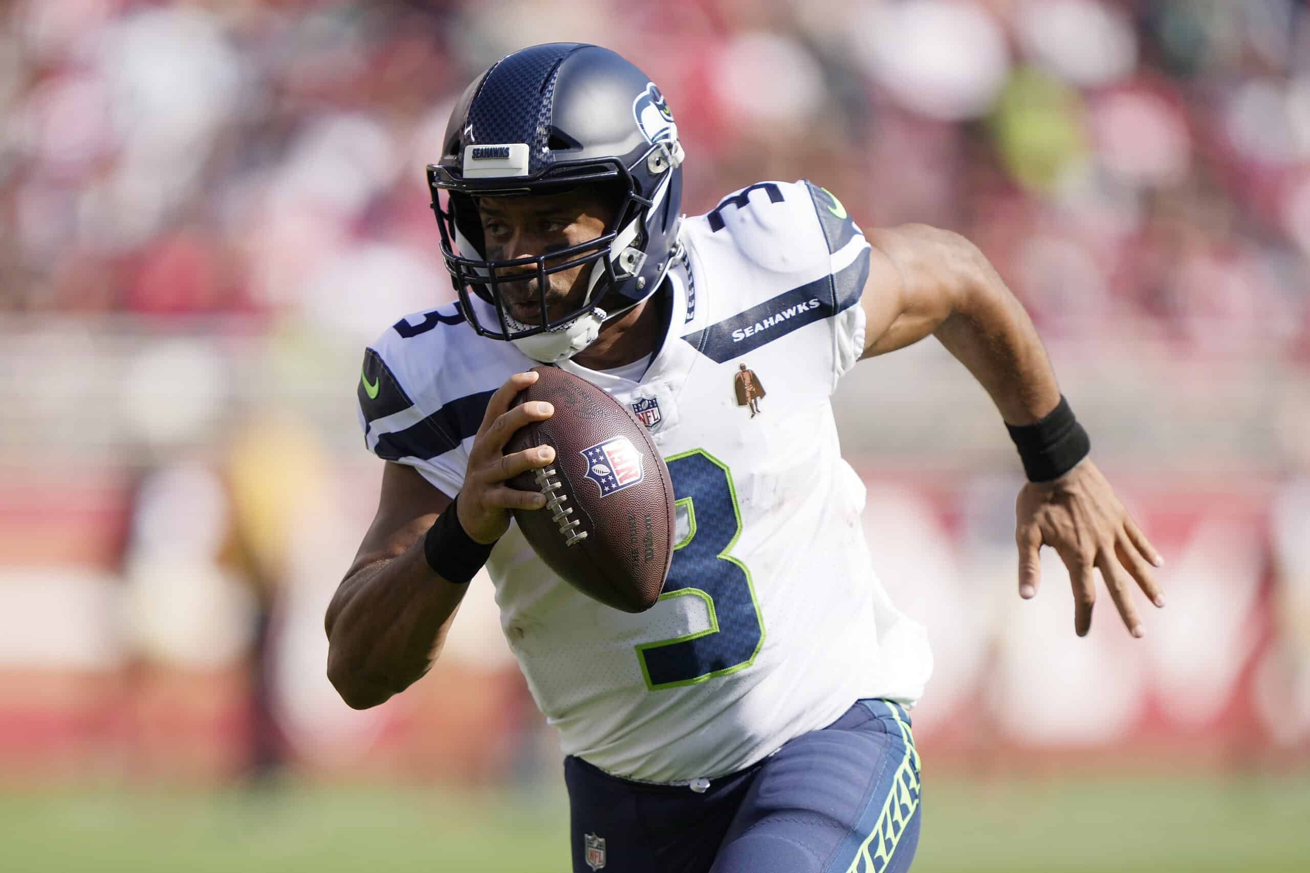 Russell Wilson #3 of the Seattle Seahawks runs for a touchdown during the third quarter against the San Francisco 49ers at Levi's Stadium on October 03, 2021 in Santa Clara, California.