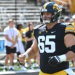 Iowa OC Tyler Linderbaum (65) warms up before a college football game between the Kent State Golden Flashes and the Iowa Hawkeyes on September 18, 2021, at Kinnick Stadium, Iowa City, IA.