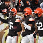 Greedy Williams #26 of the Cleveland Browns celebrates his interception against the Las Vegas Raiders with teammates during the second half at FirstEnergy Stadium on December 20, 2021 in Cleveland, Ohio.