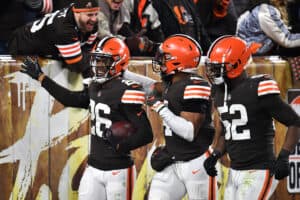 Greedy Williams #26 of the Cleveland Browns celebrates his interception against the Las Vegas Raiders with teammates during the second half at FirstEnergy Stadium on December 20, 2021 in Cleveland, Ohio.