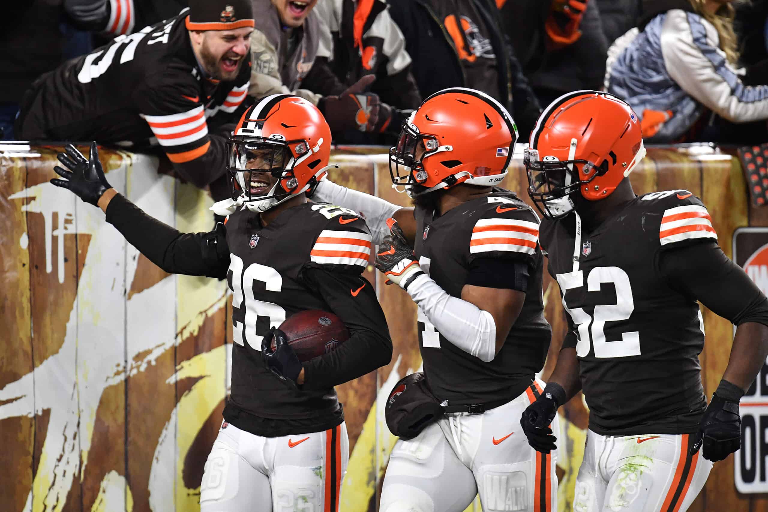 Greedy Williams #26 of the Cleveland Browns celebrates his interception against the Las Vegas Raiders with teammates during the second half at FirstEnergy Stadium on December 20, 2021 in Cleveland, Ohio. 