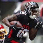 Calvin Ridley #18 of the Atlanta Falcons runs with the ball after the catch against Kendall Fuller #29 of the Washington Football Team in the first quarter at Mercedes-Benz Stadium on October 03, 2021 in Atlanta, Georgia.