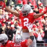 Chris Olave #2 of the Ohio State Buckeyes celebrates a first half touchdown catch against the Michigan State Spartans with Luke Wypler #53 of the Ohio State Buckeyes at Ohio Stadium on November 20, 2021 in Columbus, Ohio.