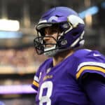 Kirk Cousins #8 of the Minnesota Vikings looks on from the sidelines during the game against the Chicago Bears at U.S. Bank Stadium on January 09, 2022 in Minneapolis, Minnesota.