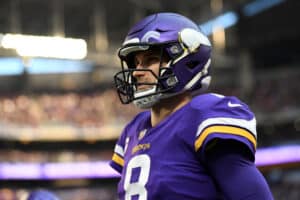 Kirk Cousins #8 of the Minnesota Vikings looks on from the sidelines during the game against the Chicago Bears at U.S. Bank Stadium on January 09, 2022 in Minneapolis, Minnesota.