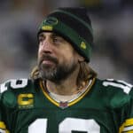 Aaron Rodgers #12 of the Green Bay Packers leaves the field following a game against the Cleveland Browns at Lambeau Field on December 25, 2021 in Green Bay, Wisconsin. The Packers defeated the Browns 24-22.