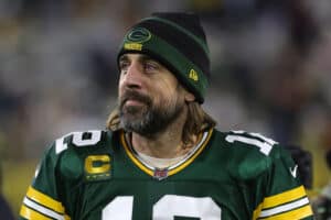 Aaron Rodgers #12 of the Green Bay Packers leaves the field following a game against the Cleveland Browns at Lambeau Field on December 25, 2021 in Green Bay, Wisconsin. The Packers defeated the Browns 24-22.