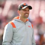Chad O'Shea smiles during warmups before a game against the Pittsburgh Steelers at FirstEnergy Stadium on October 31, 2021 in Cleveland, Ohio.