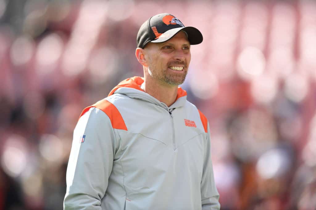 Chad O'Shea smiles during warmups before a game against the Pittsburgh Steelers at FirstEnergy Stadium on October 31, 2021 in Cleveland, Ohio.