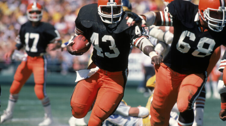 Full back Mike Pruitt #43 of the Cleveland Browns follows his blocker center Robert Jackson #68 during a game against the San Diego Chargers at Jack Murphy Stadium on September 25, 1983 in San Diego, California. The Browns won 30-24 in overtime.