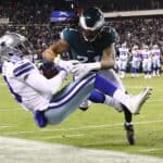 Amari Cooper #19 of the Dallas Cowboys is tackled by Andre Chachere #21 of the Philadelphia Eagles in the second quarter of the game at Lincoln Financial Field on January 08, 2022 in Philadelphia, Pennsylvania.