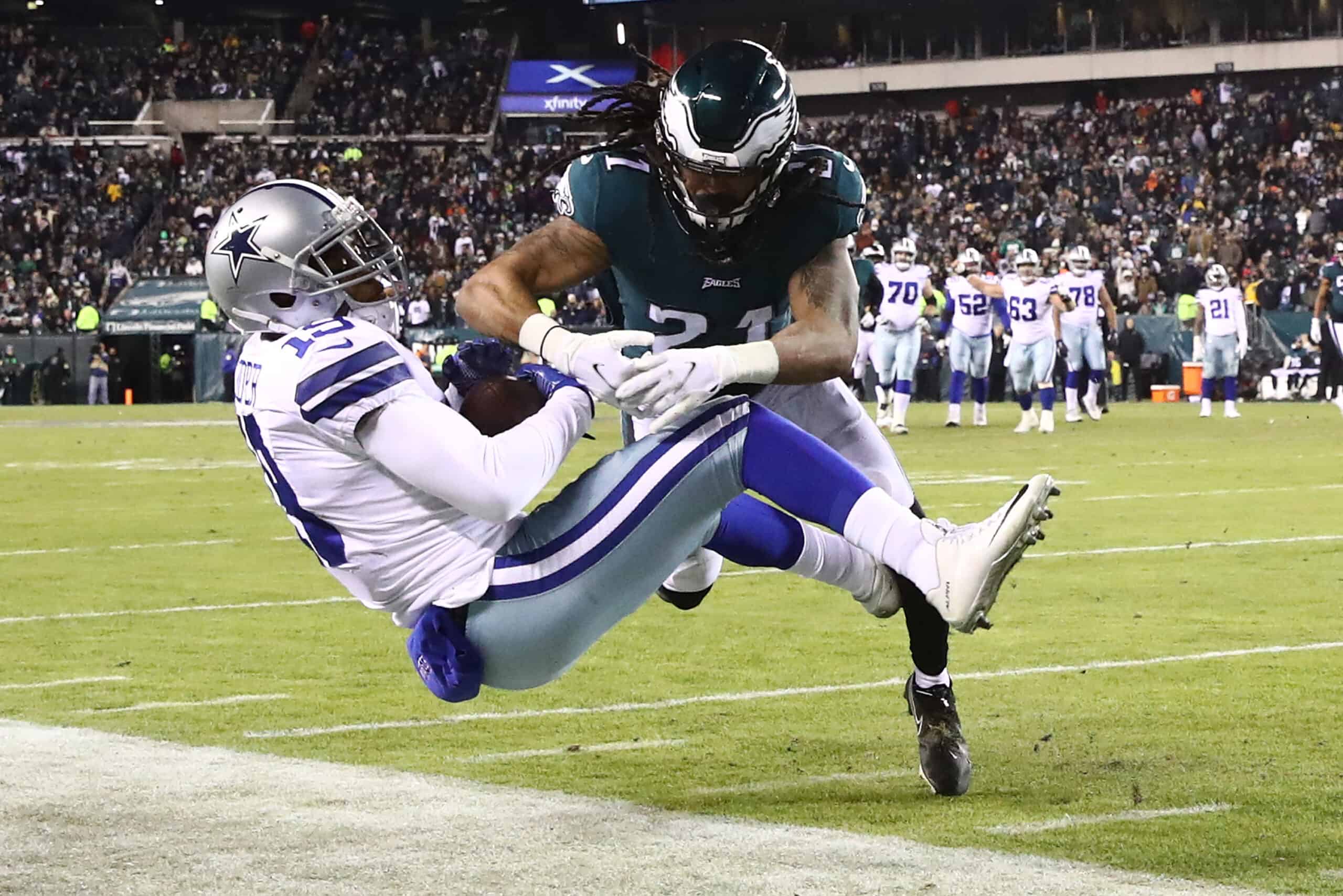 Amari Cooper #19 of the Dallas Cowboys is tackled by Andre Chachere #21 of the Philadelphia Eagles in the second quarter of the game at Lincoln Financial Field on January 08, 2022 in Philadelphia, Pennsylvania.