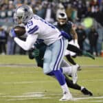 Amari Cooper #19 of the Dallas Cowboys makes a reception past K'Von Wallace #42 of the Philadelphia Eagles at Lincoln Financial Field on January 08, 2022 in Philadelphia, Pennsylvania.
