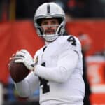 Quarterback Derek Carr #4 of the Las Vegas Raiders warms up before the start of the AFC Wild Card playoff game against the Cincinnati Bengals at Paul Brown Stadium on January 15, 2022 in Cincinnati, Ohio.