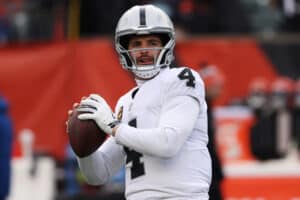 Quarterback Derek Carr #4 of the Las Vegas Raiders warms up before the start of the AFC Wild Card playoff game against the Cincinnati Bengals at Paul Brown Stadium on January 15, 2022 in Cincinnati, Ohio.