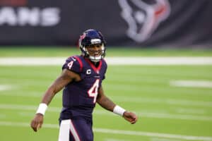 Deshaun Watson #4 of the Houston Texans reacts to a touchdown during the second half of a game against the Tennessee Titans at NRG Stadium on January 03, 2021 in Houston, Texas.