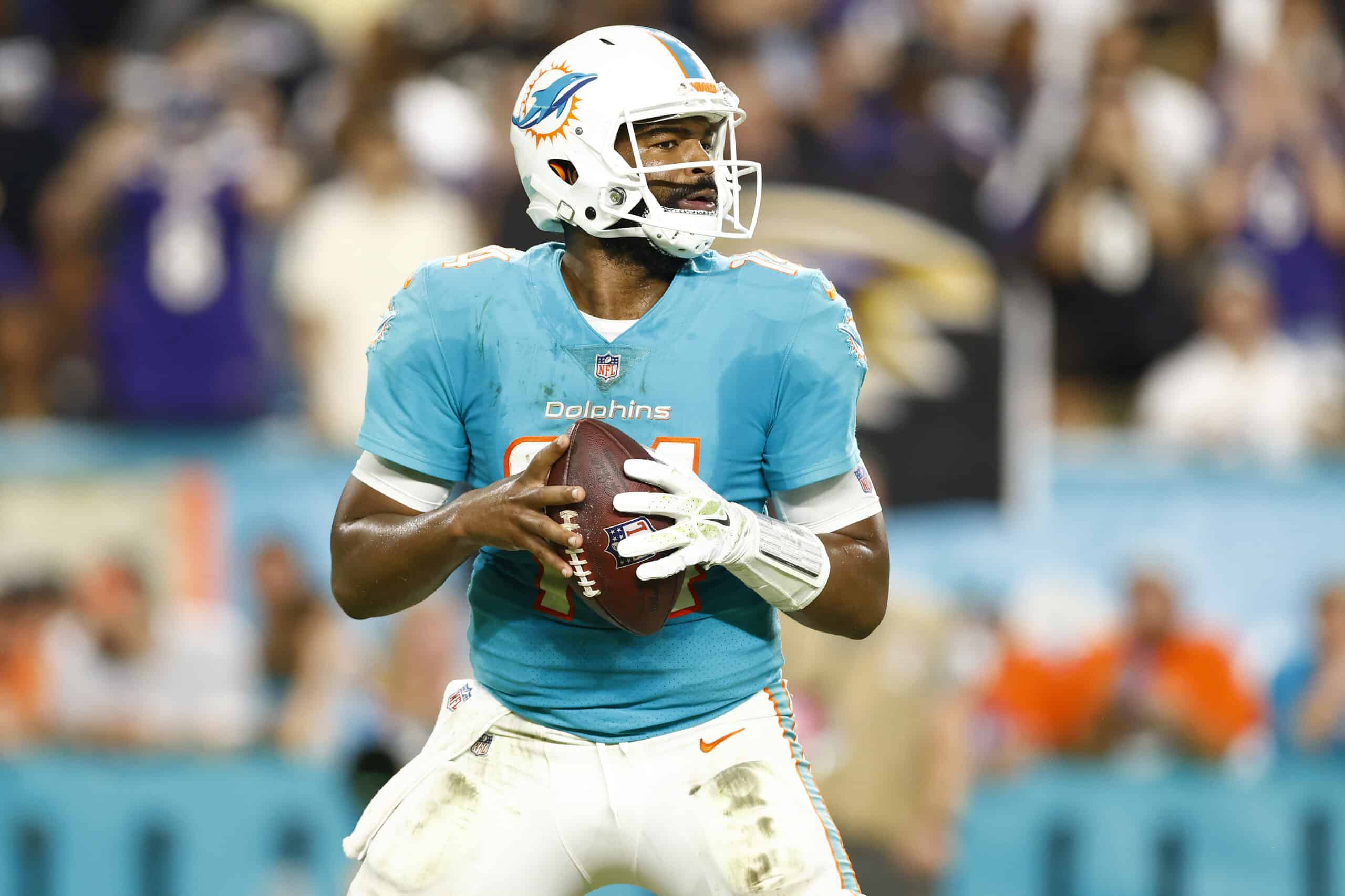 Jacoby Brissett #14 of the Miami Dolphins looks to pass against the Baltimore Ravens during the first quarter in the game at Hard Rock Stadium on November 11, 2021 in Miami Gardens, Florida. 