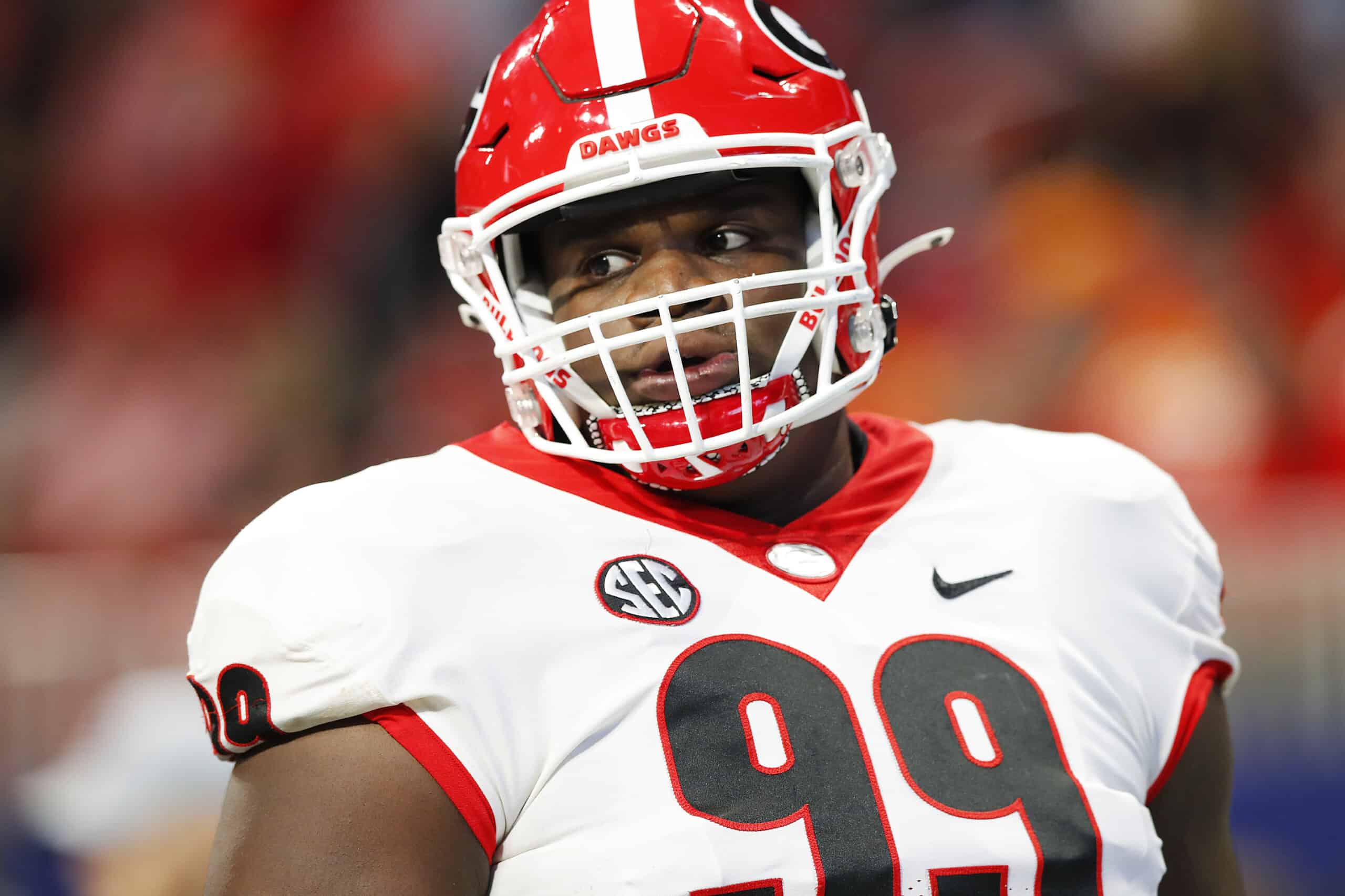 Jordan Davis #99 of the Georgia Bulldogs looks on before the SEC Championship game against the Alabama Crimson Tide at Mercedes-Benz Stadium on December 04, 2021 in Atlanta, Georgia. 