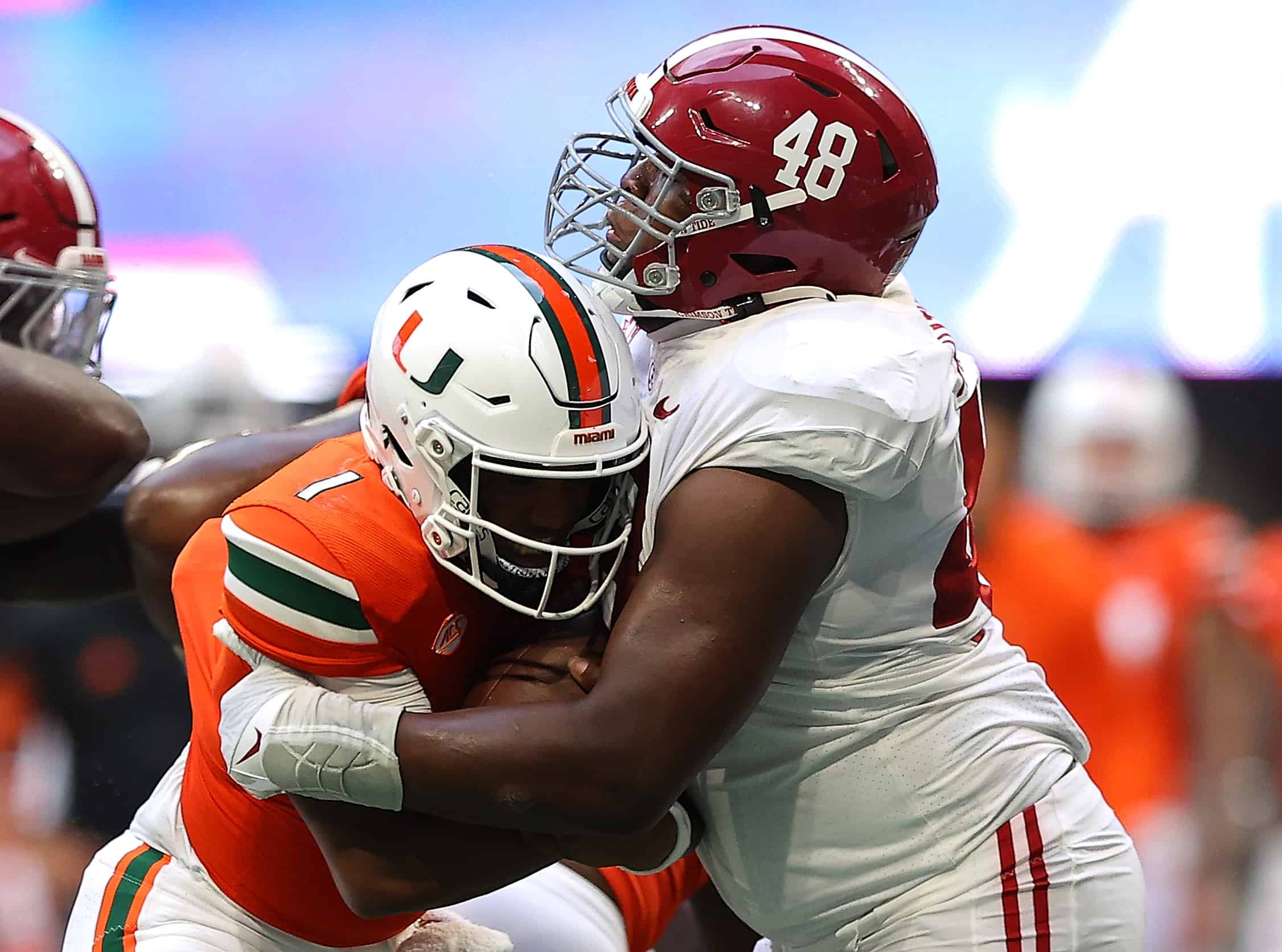 D'Eriq King #1 of the Miami Hurricanes is tackled by Phidarian Mathis #48 of the Alabama Crimson Tide during the second half of the Chick-fil-A Kick-Off Game at Mercedes-Benz Stadium on September 04, 2021 in Atlanta, Georgia.