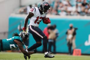 Brandin Cooks #13 of the Houston Texans scores a touchdown during the first quarter against the Jacksonville Jaguars at TIAA Bank Field on December 19, 2021 in Jacksonville, Florida. (Photo by Douglas P.