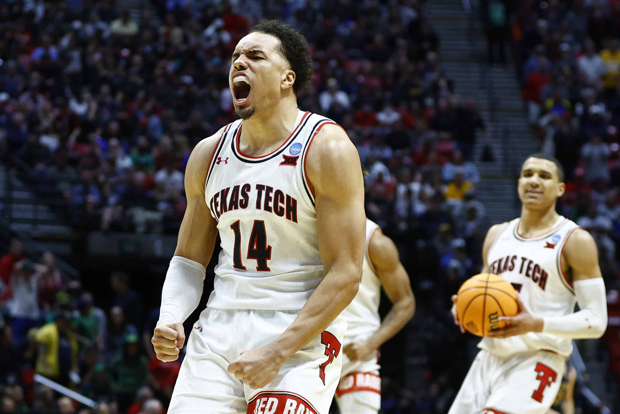 Marcus Santos-Silva #14 of the Texas Tech Red Raiders celebrates during the second half against the Notre Dame Fighting Irish in the second round game of the 2022 NCAA Men's Basketball Tournament at Viejas Arena at San Diego State University on March 20, 2022 in San Diego, California. 